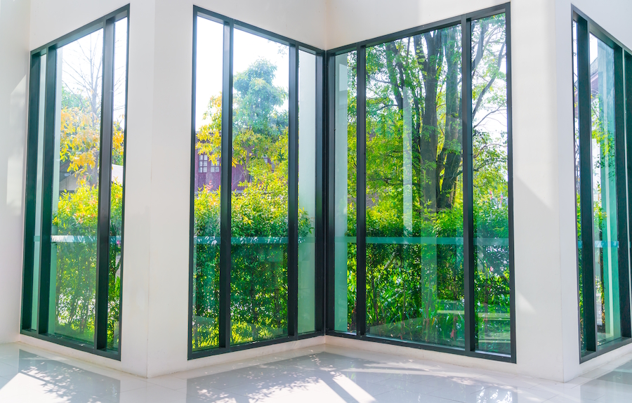 Glass window overlooking green garden Glass window overlooking green garden
